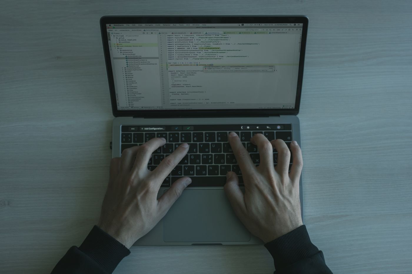 Developer building an automation workflow and integration code on a laptop