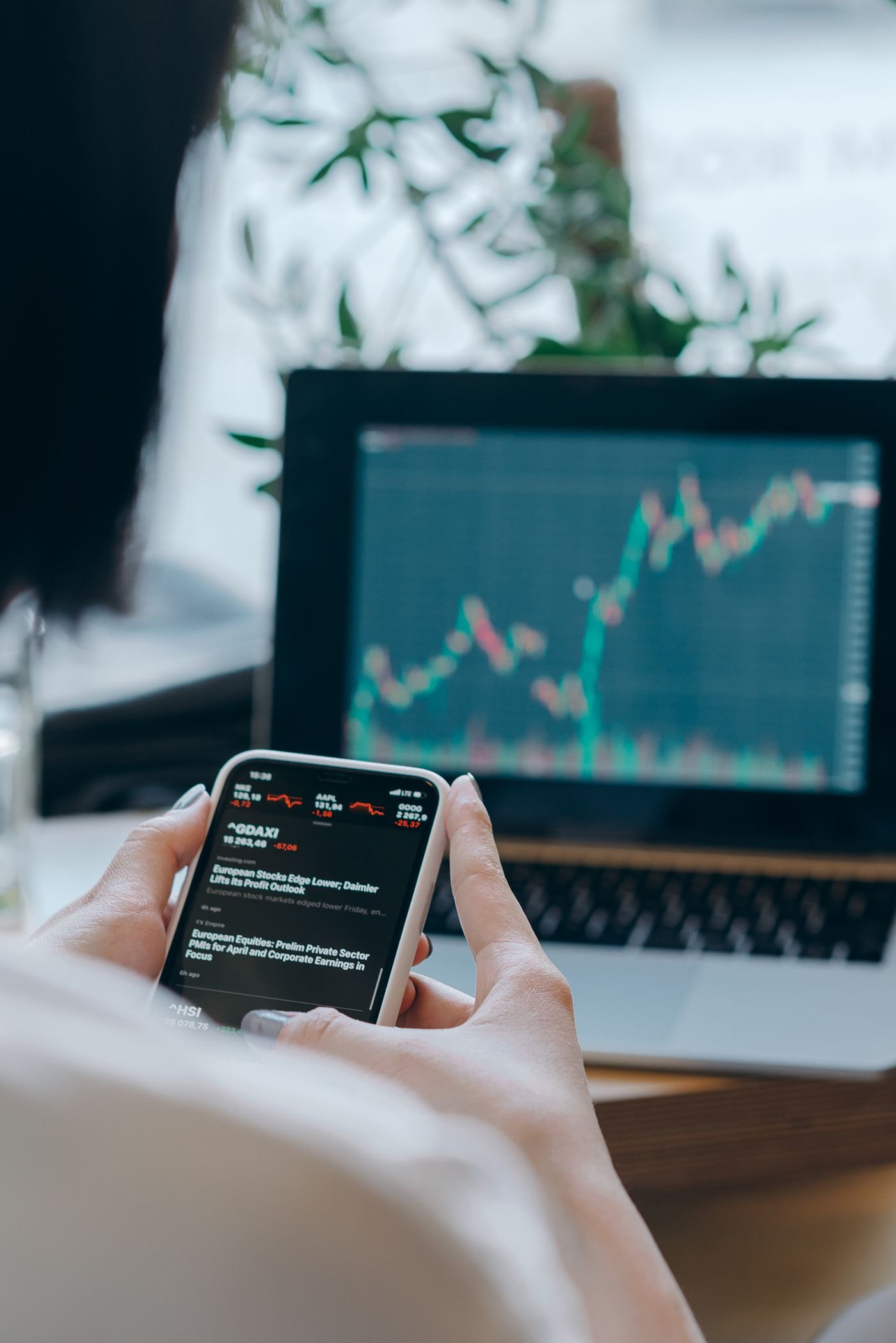 Marketer reviewing ad campaign performance and ROI data on screen